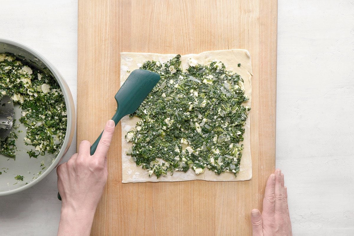 Spread each sheet with half the spinach mixture to within 1/2 in. of edges.