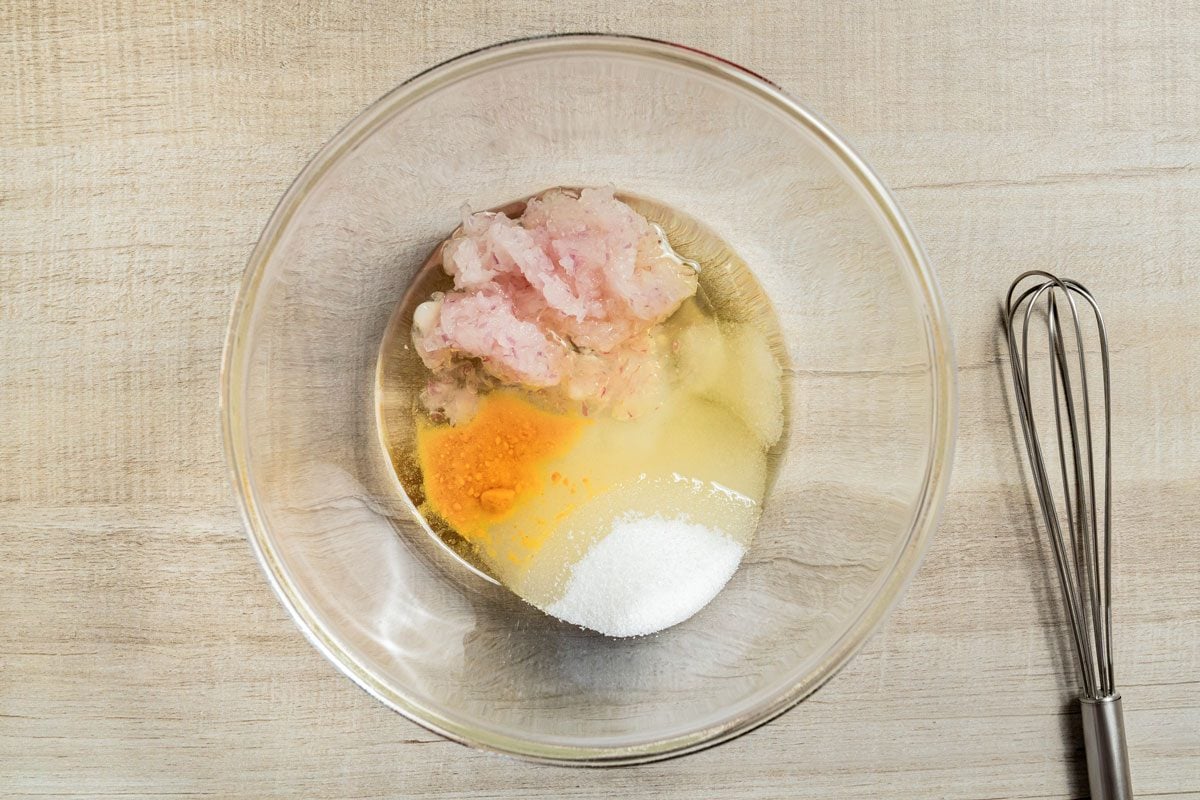 In a small bowl, whisk the oil, 1/4 cup sugar, vinegar, onion, mustard and salt until sugar is completely dissolved;