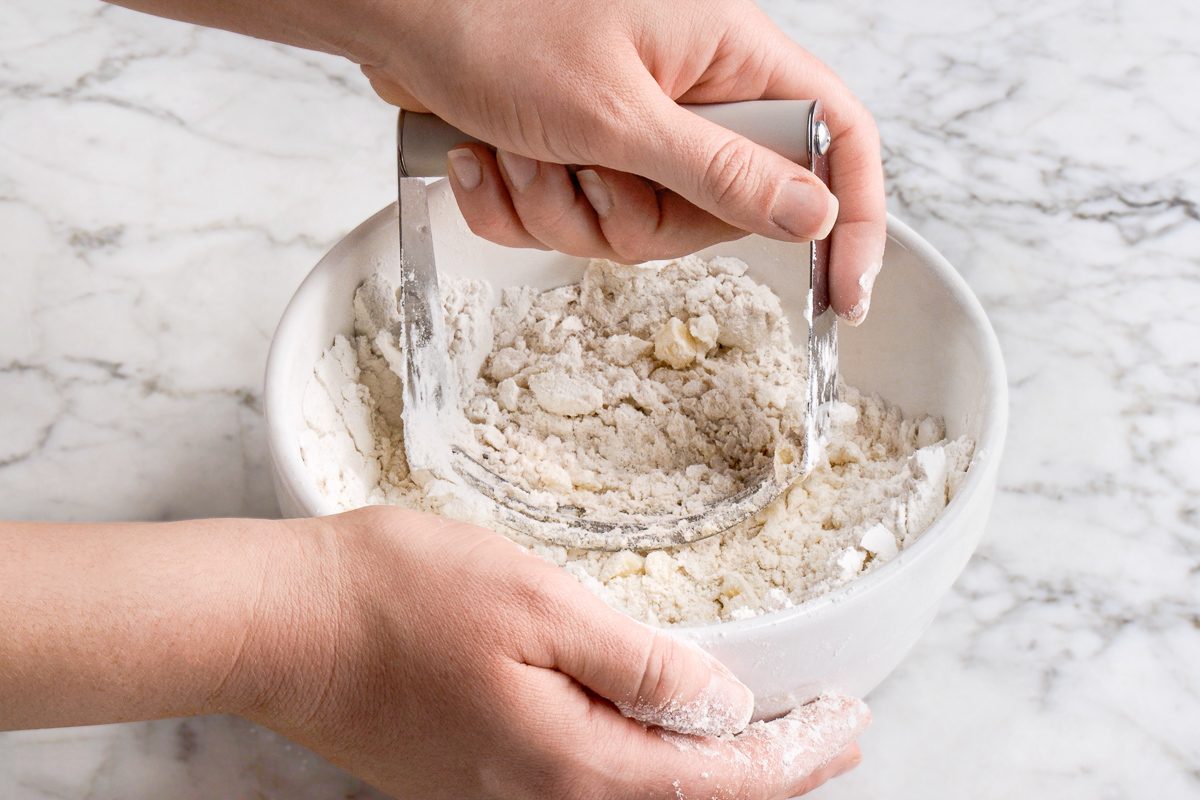 mixing flour, salt, shortening and butter in a bowl