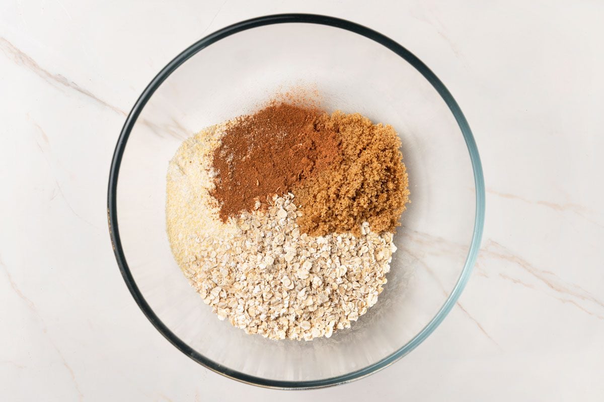 In another bowl, combine cornbread mix, oats, cinnamon and remaining brown sugar.