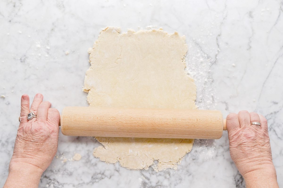 rolling out dough with a rolling pin