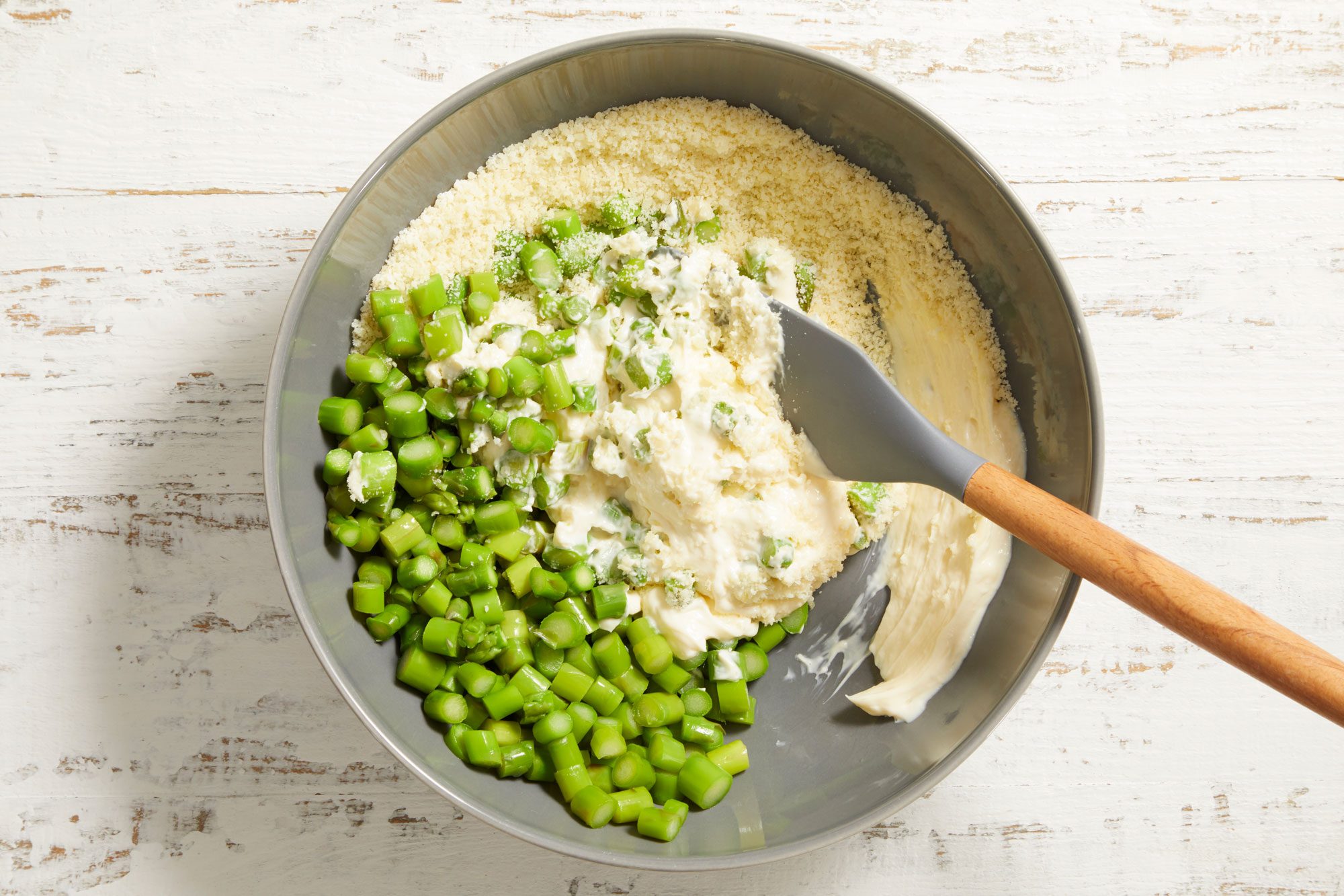 In a large bowl, combine the asparagus, cheese and mayonnaise.