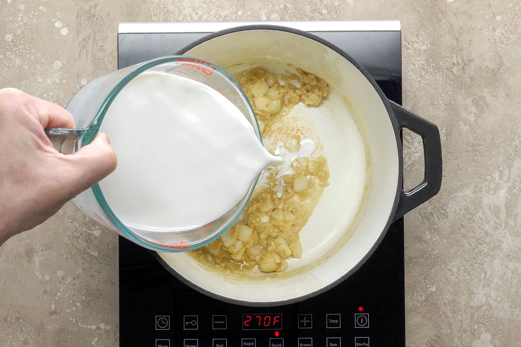gradually whisk in milk in a Dutch oven;