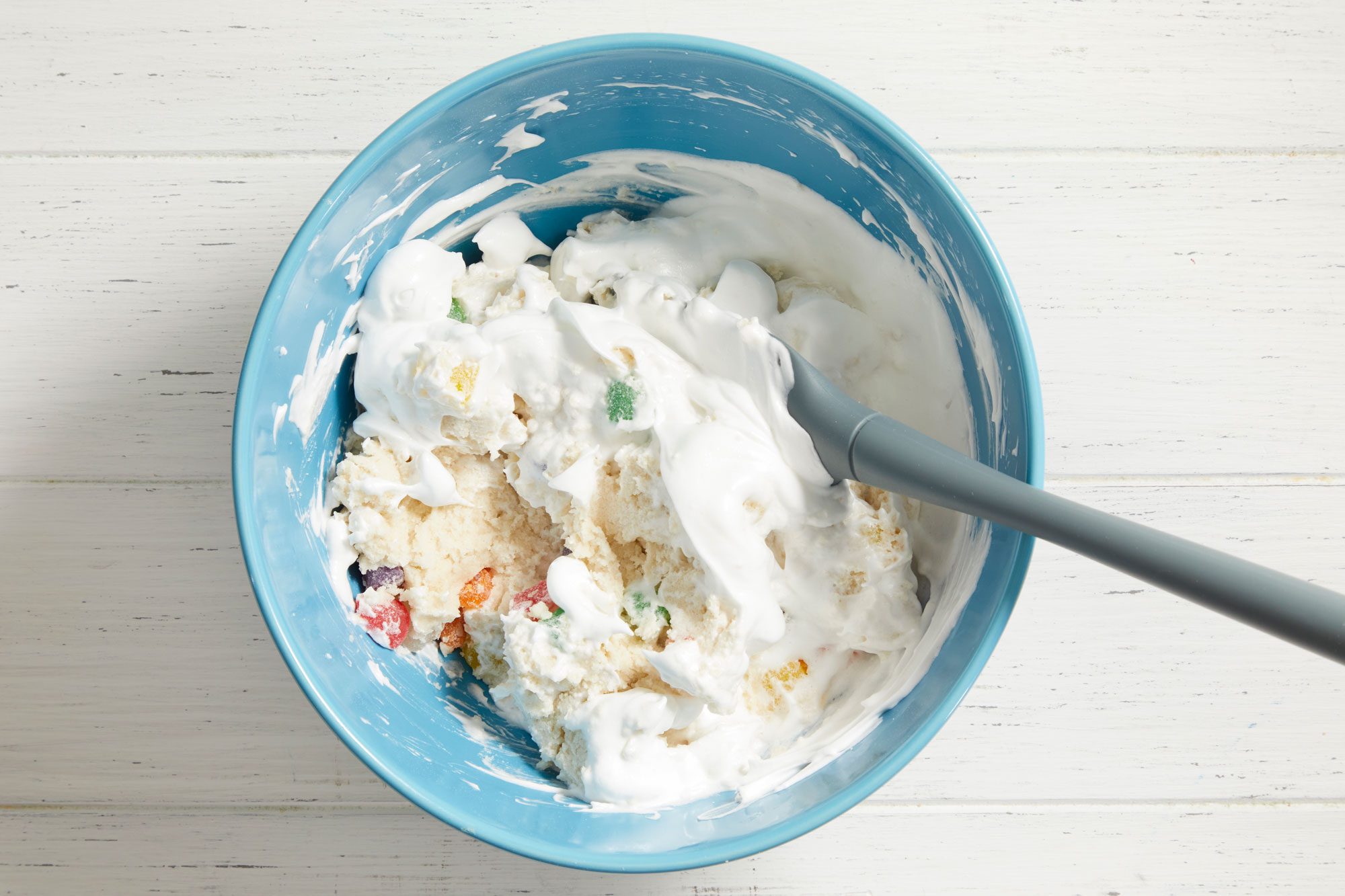 Gradually add remaining sugar, beating until stiff peaks form. Fold into dough