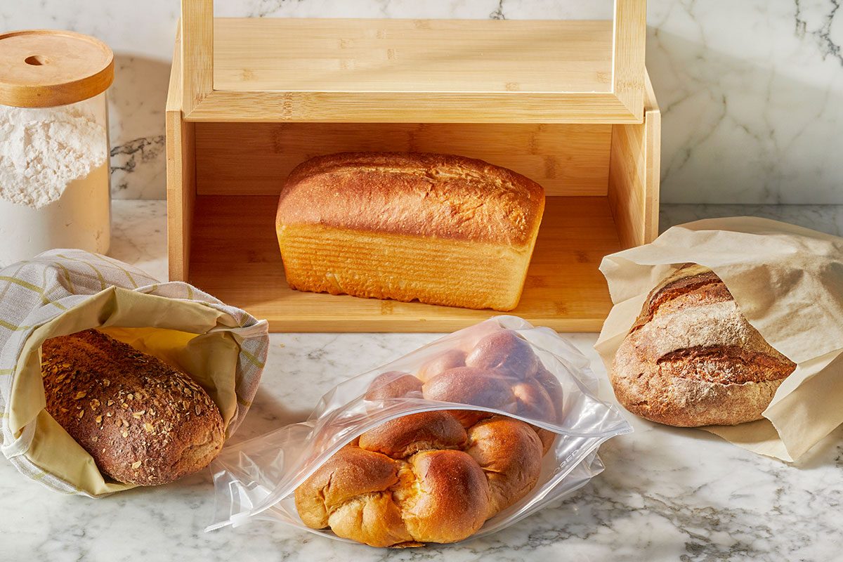 Various kind of breads placed on a table near wodden box