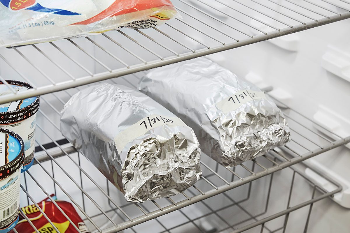 Two whole bread wrapped in a foil and placed in a freezer