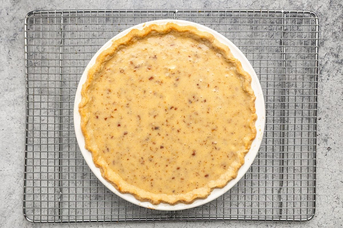 In another bowl cream the butter; sugar; flour and salt; Add the eggs; milk and vanilla; beat well; Stir in the pecans; Pour into prepared crust