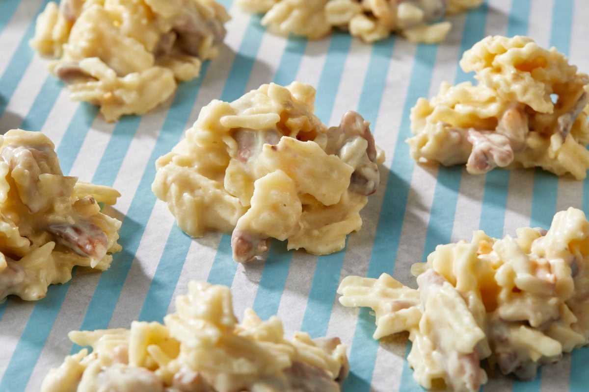 Close-up shot of Potato Chip Clusters arranged on a blue-and-white striped sheet;