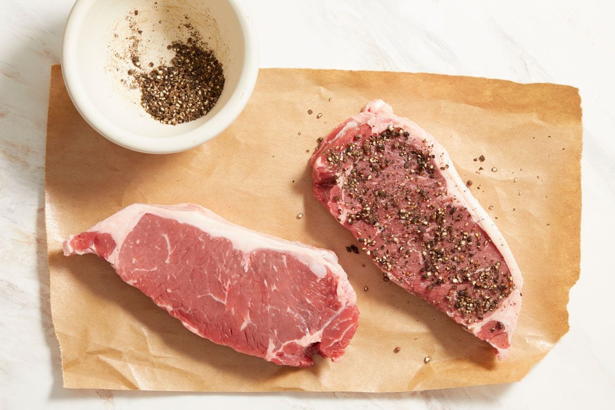 Rub pepper over both sides of steaks
