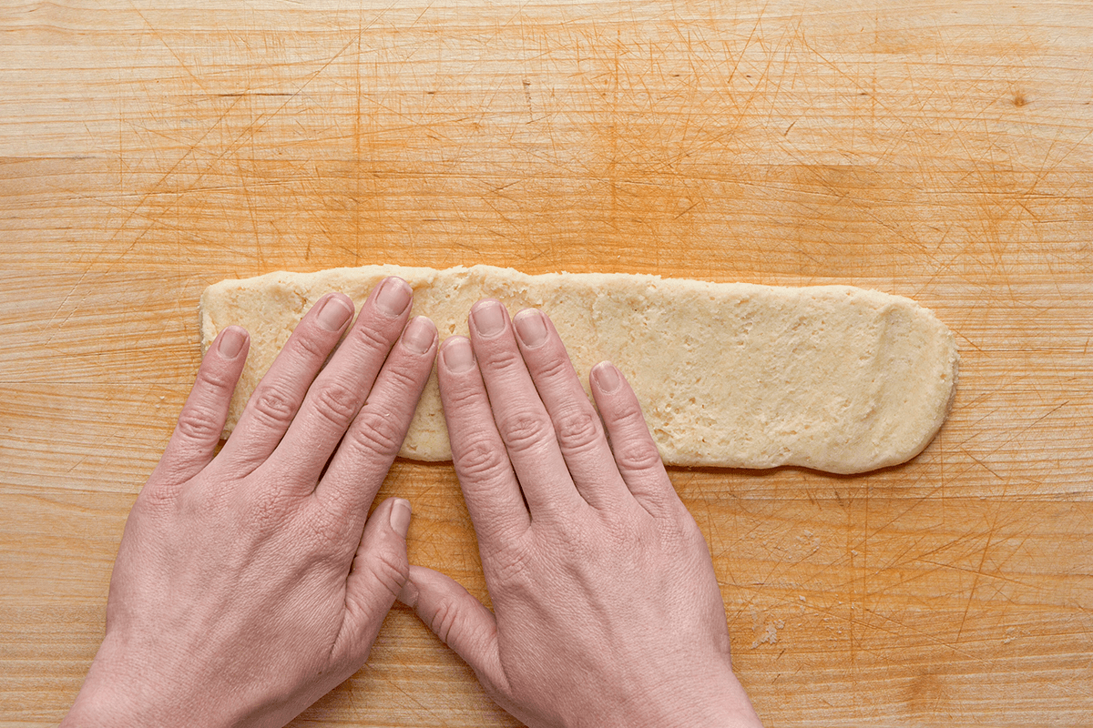 Spreading cookie dough as strips