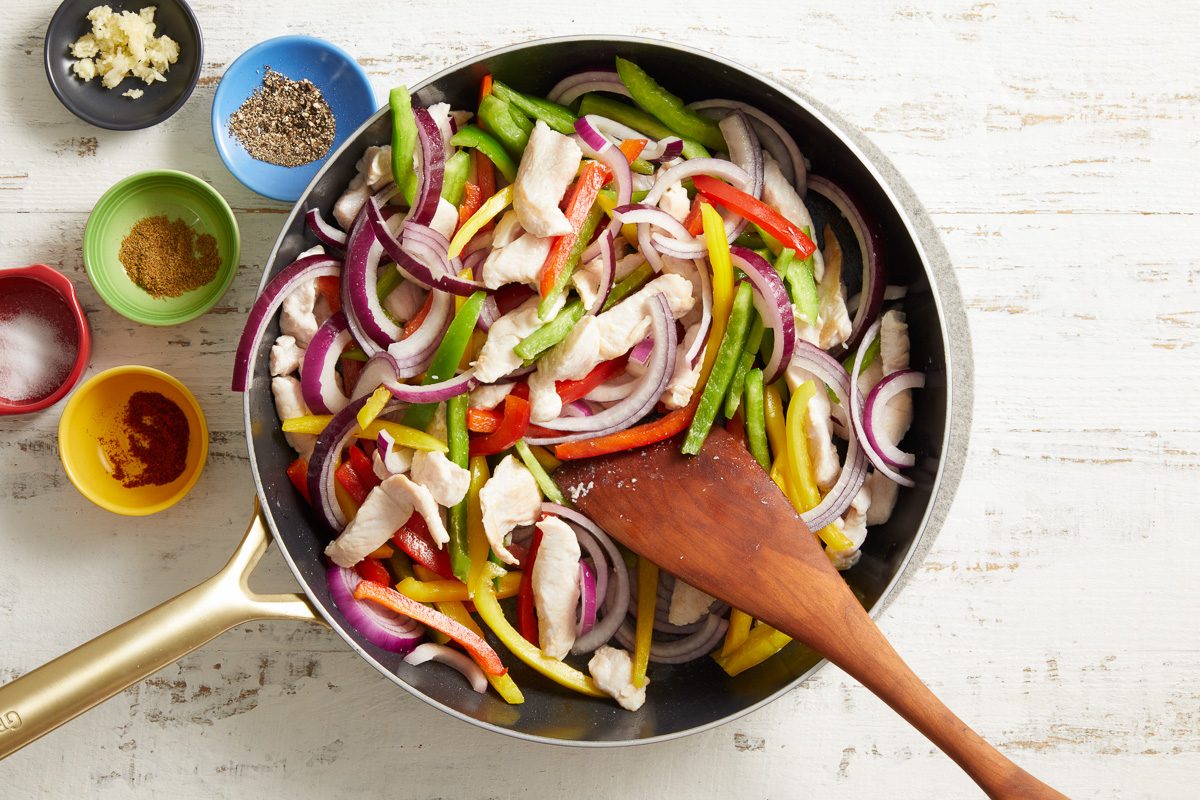 vegetables added to turkey in a skillet