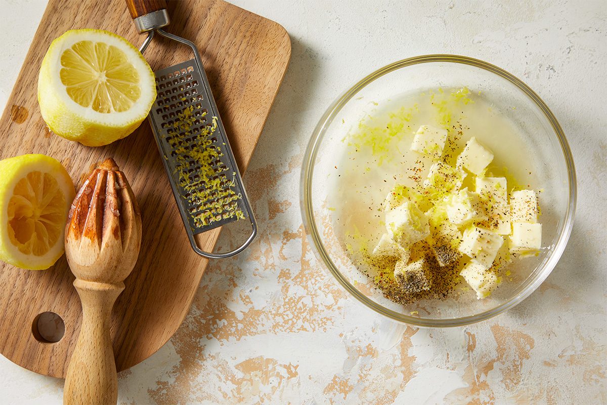 In a small microwave-safe bowl, combine the butter, lemon juice, garlic pepper and lemon zest.