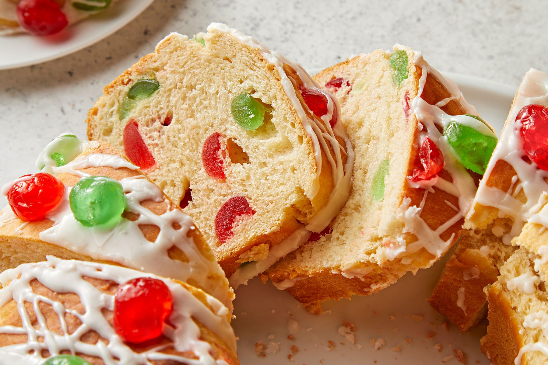 Christmas Bread with glaze and candied fruit cut into small pieces.