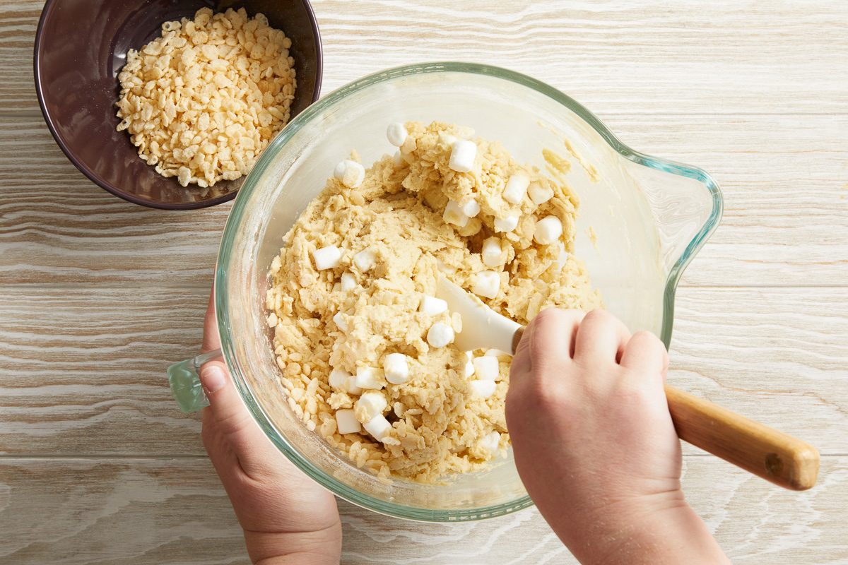 marshmallows being folded into cookie dough