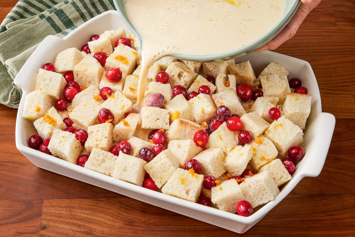 custard base being poured over bread mixture