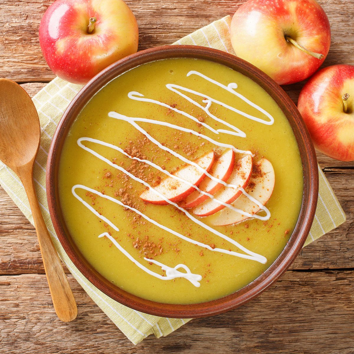 Spicy autumn recipe Apfelsuppe Apple puree soup close-up in a plate.