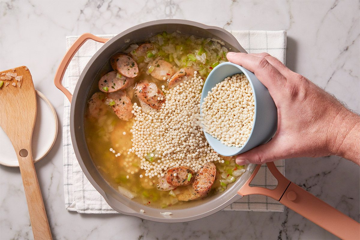 Stir in broth, water and pepper flakes; bring to a boil. Stir in couscous.