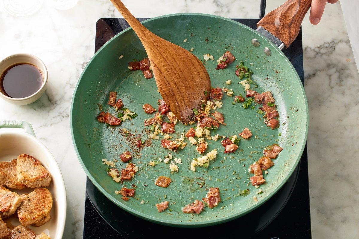 garlic and sage added to pan with chopped prosciutto